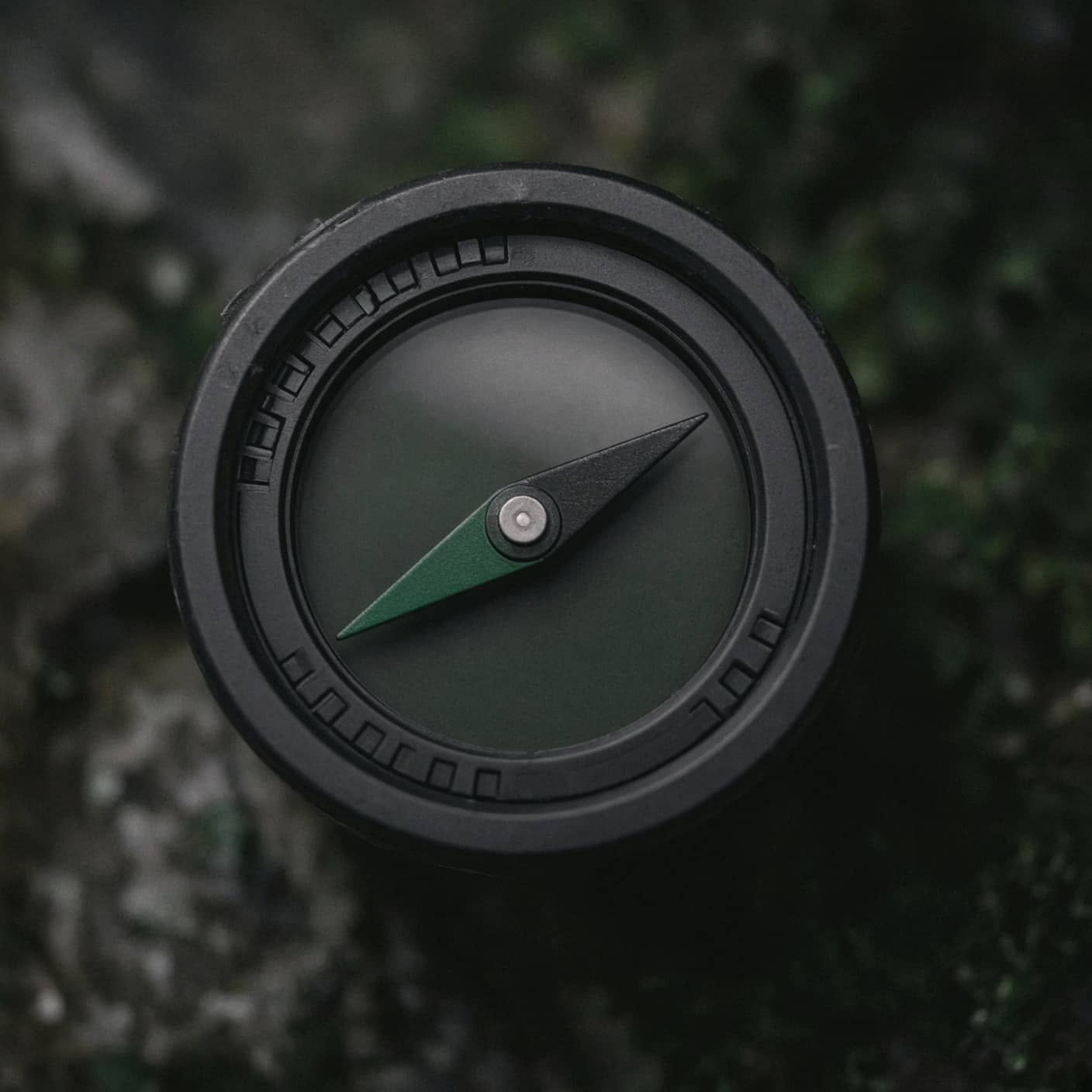 Macro of a compass bezel and needle
