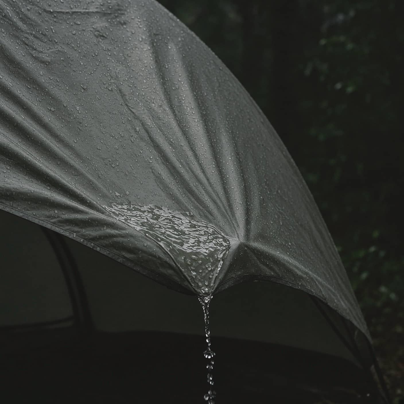 Rain pooling and sheeting off a tent fly