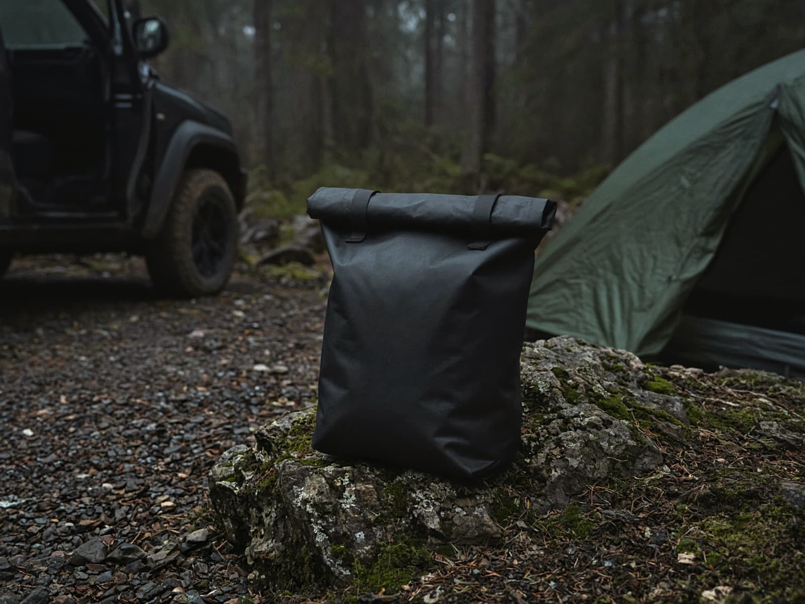 A 10-liter roll-top dry bag at a car campsite