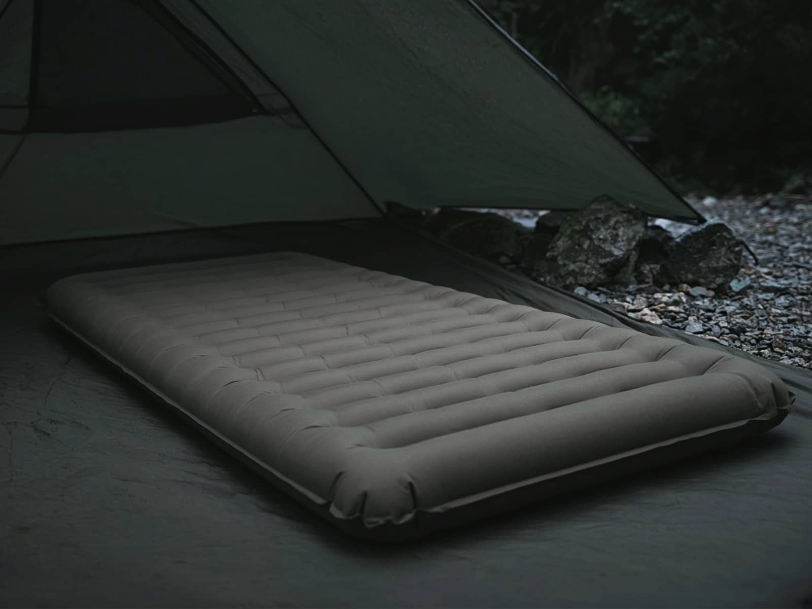 A plush thick air pad on a tent floor