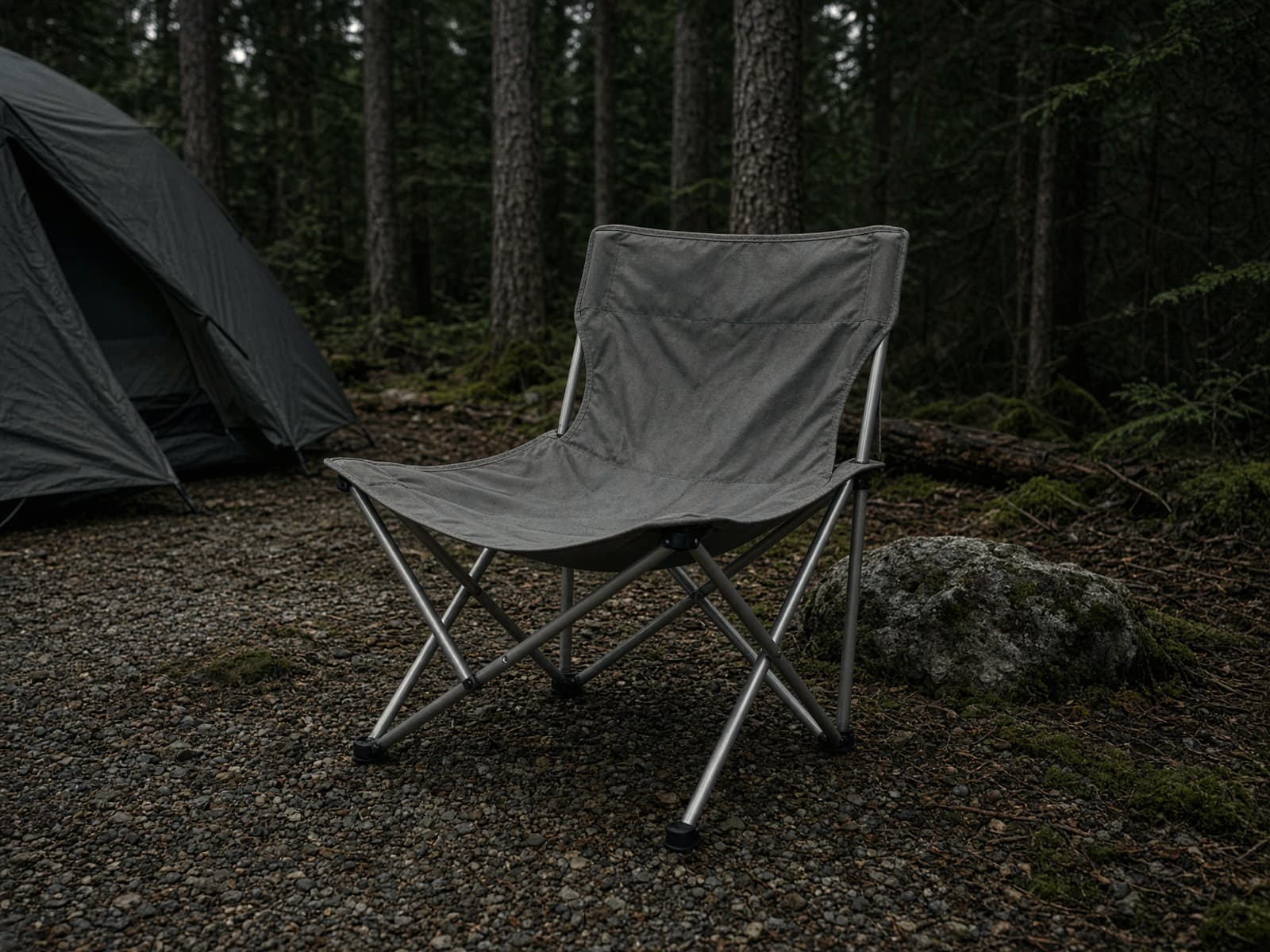 A packable aluminum-frame camp chair at a car campsite