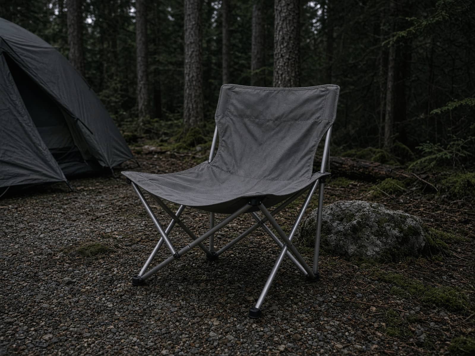 A packable aluminum-frame camp chair at a car campsite