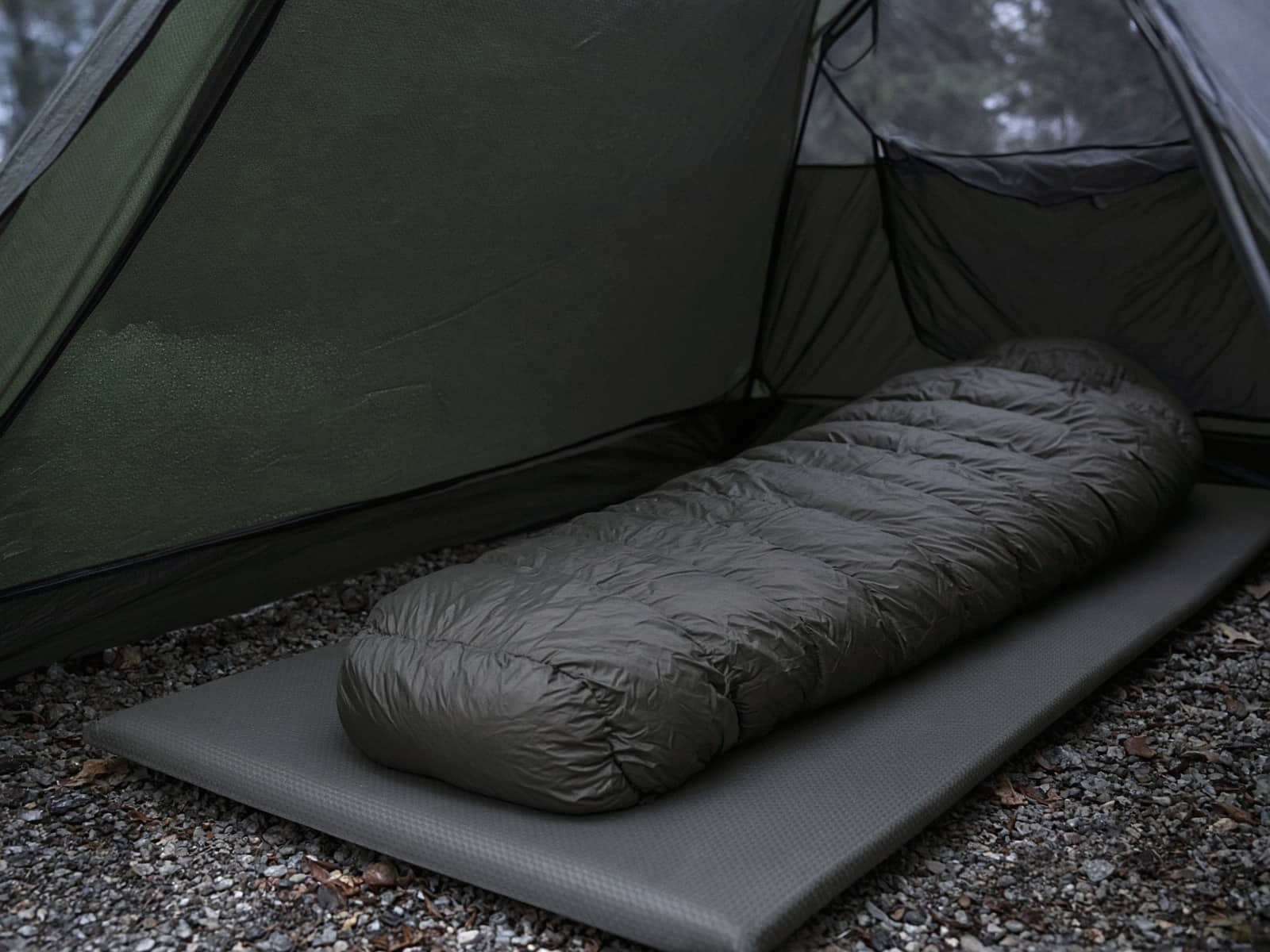 A budget down mummy bag lofted on a pad inside a tent