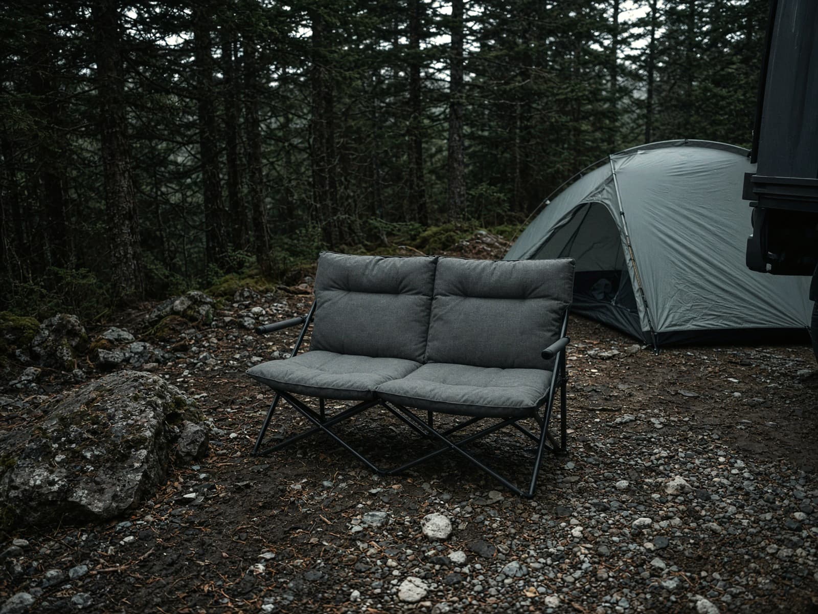A two-person low camp loveseat at a car campsite
