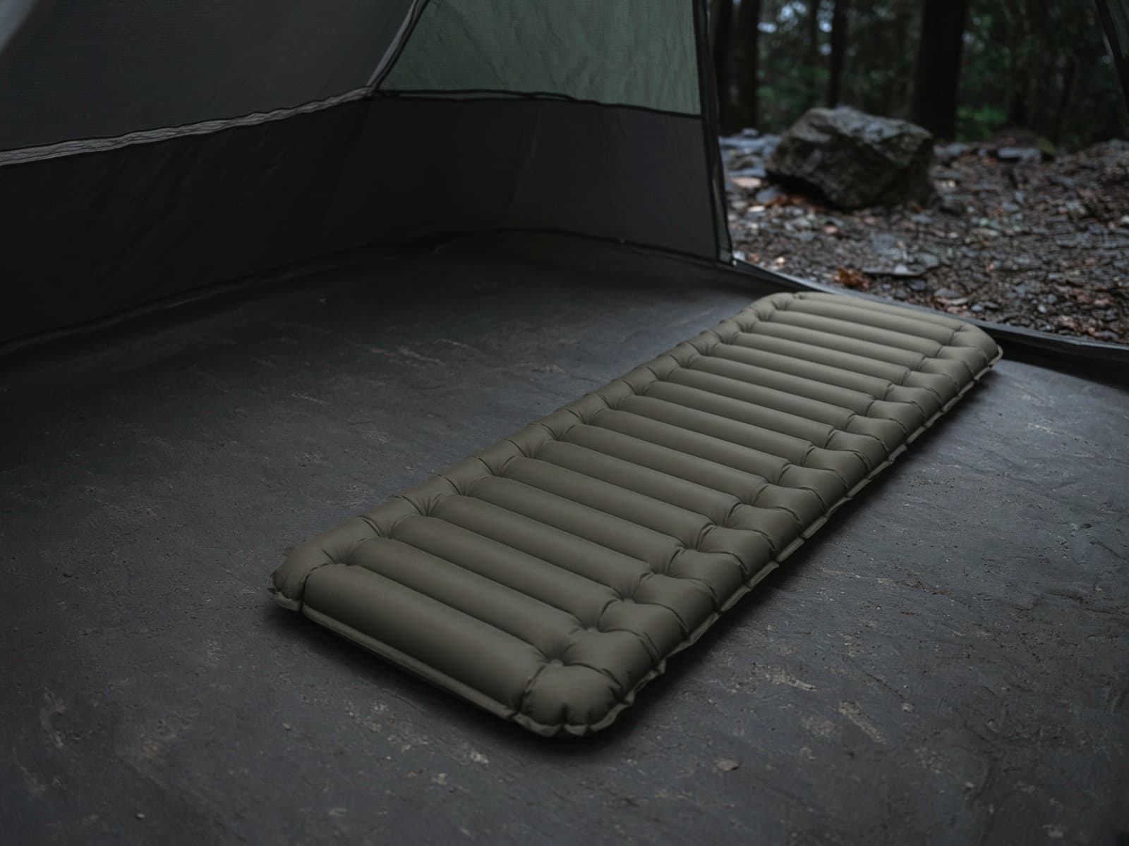 A budget V-chambered air pad on a tent floor