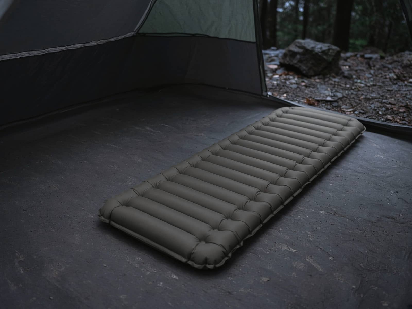 A budget V-chambered air pad on a tent floor