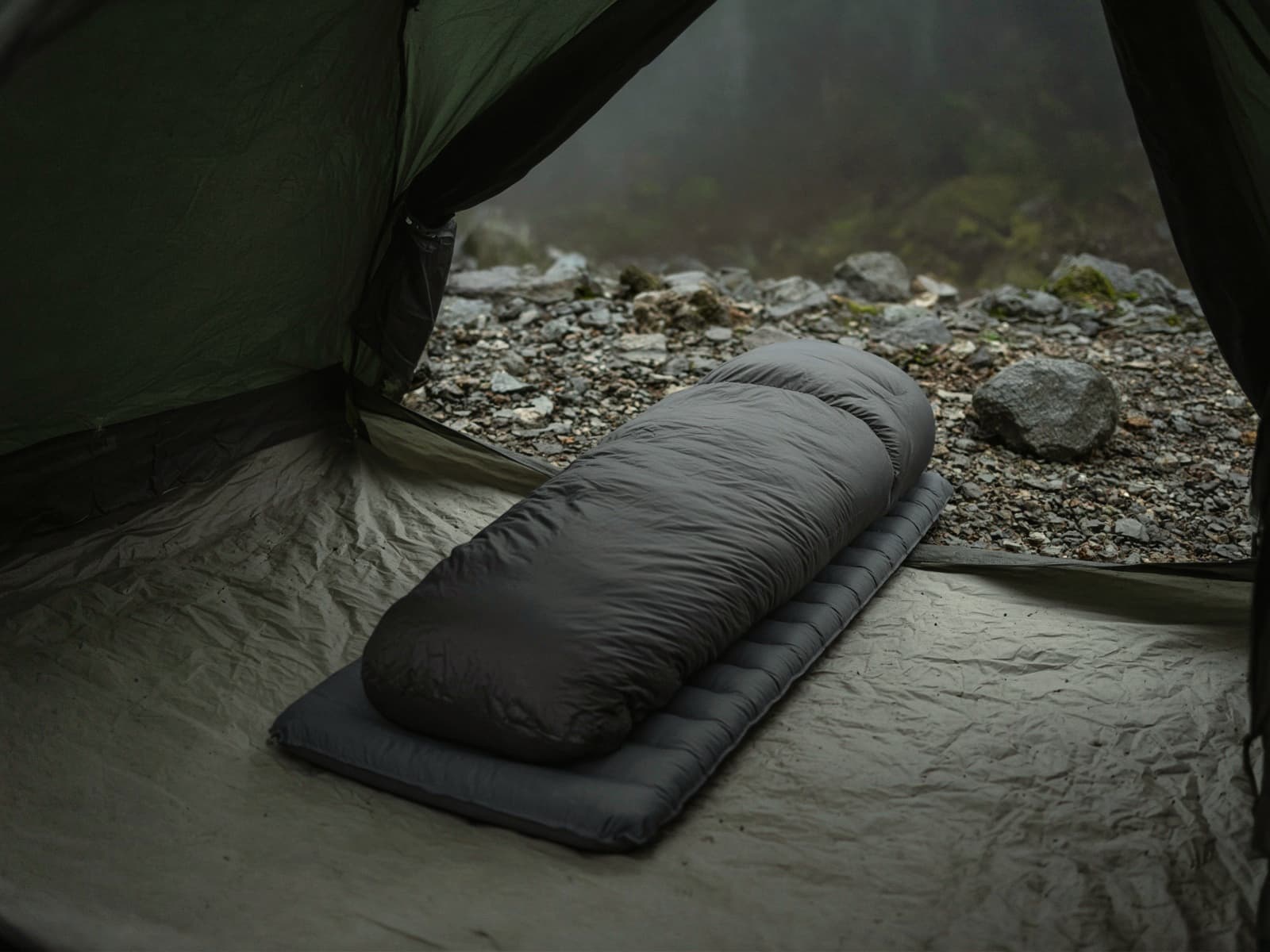 A 30-degree down mummy bag lofted on a pad inside a tent