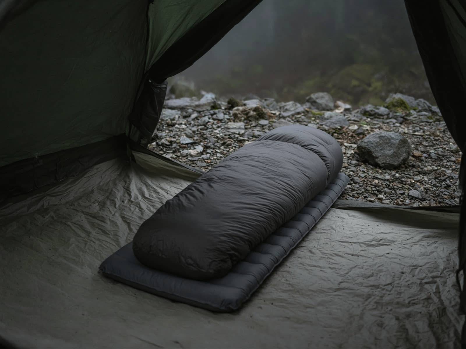 A 30-degree down mummy bag lofted on a pad inside a tent