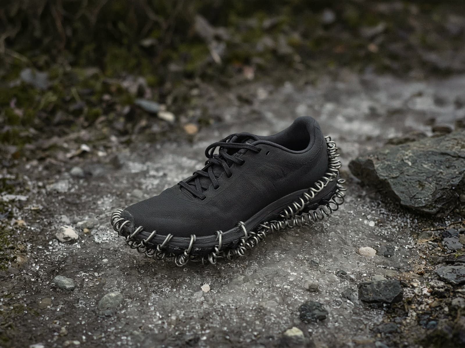 Coil traction on a running shoe on an icy trail