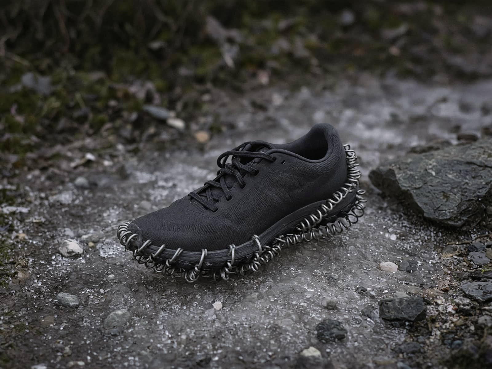 Coil traction on a running shoe on an icy trail